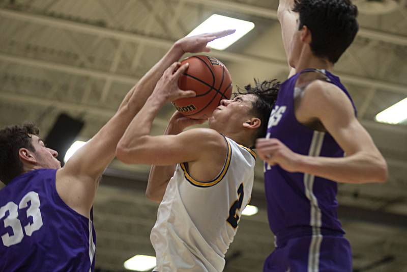 Sterling's JP Schilling is fouled going to the hoop against Rochelle in the regional finals Friday, Feb. 25, 20212.