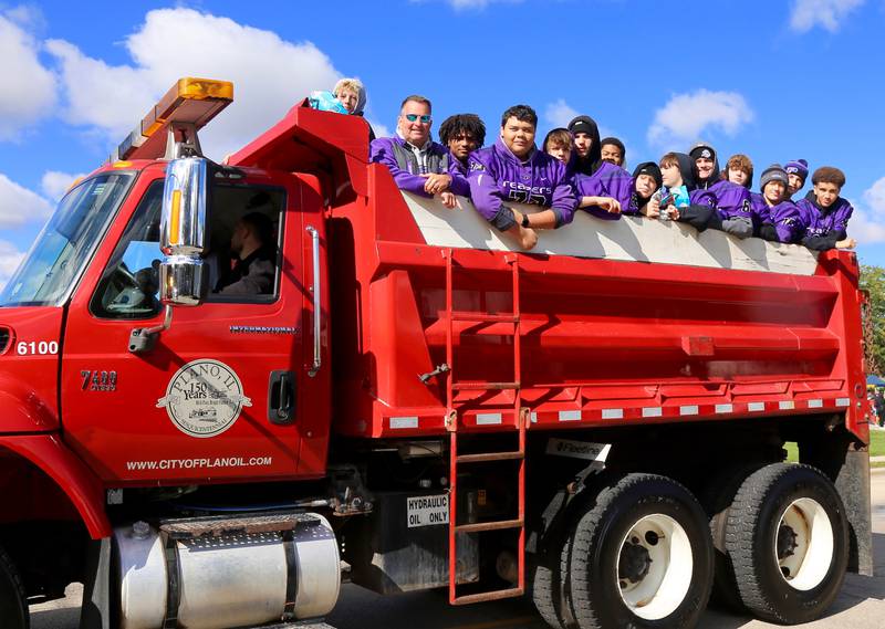 Plano High School Junior Varsity football players participate in the Plano High School Homecoming Parade on Saturday, Oct. 7, 2023 in Plano.