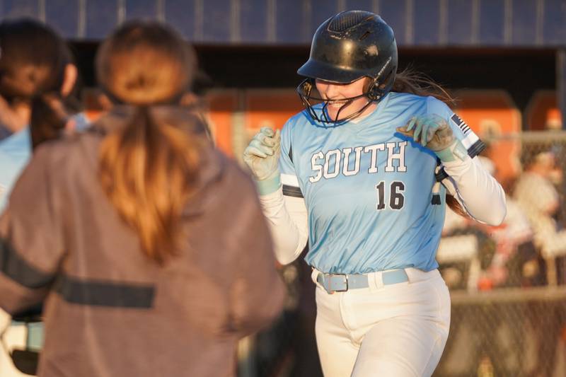 Downers Grove South's Ella Cushing (16) smiles after hitting a two run homer against Oswego during a softball game at Oswego High School on Tuesday, March 19, 2024.