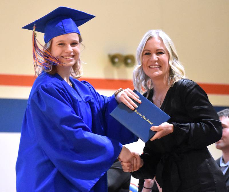 Keara Ellis shows her excitement after receiving her diploma from Genoa-Kingston Board of Education President Melyssa Gustafson Saturday, May 17, 2025, during Genoa-Kingston High School graduation at the school.