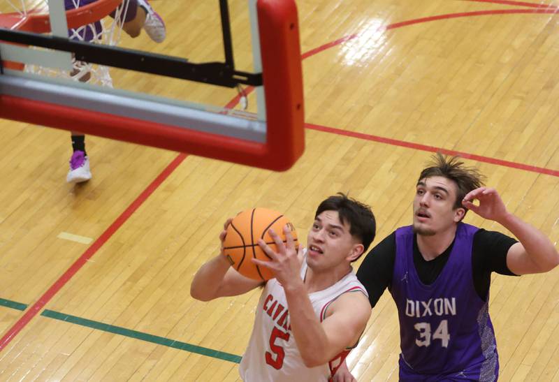 L-P's Erick Sotelo drives to the hoop as Dixon's Jakob Nicklaus trails behind during the Class 3A Regional semifinal game on Wednesday, Feb. 25, 2026 in Sellett Gymnasium at L-P High School.