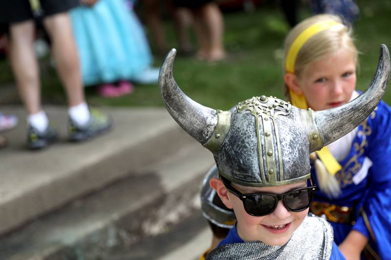 Ronan Trapp, 4, dons a pair of viking horns as Lulu Meyer, 8, looks on before the Swedish Days Kids’ Day Parade in Geneva on Friday, June 24, 2022.