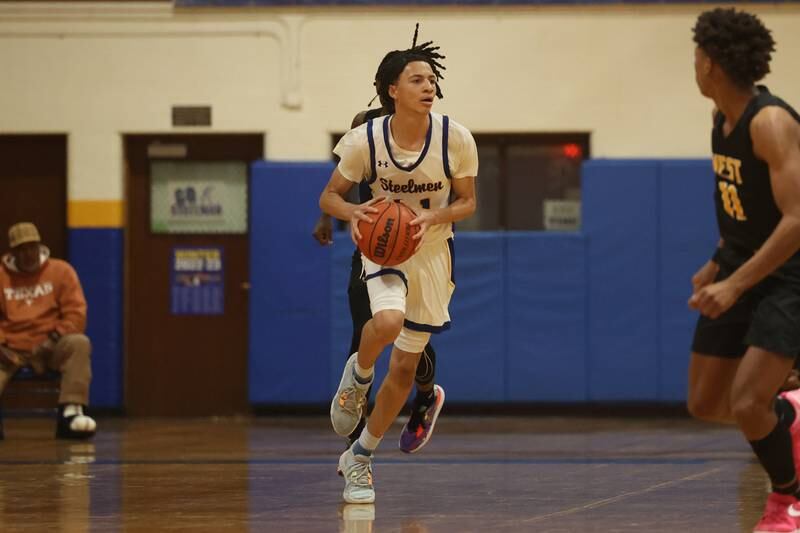 Joliet Central’s Zion Kostyra looks to pass against Joliet West.