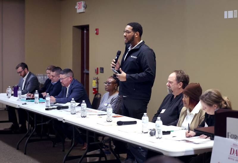 District 428 School Board candidate Brandon Elion speaks as other candidates listen in Thursday, March 20, 2025, during the DeKalb Area Rental Association and DeKalb Area Builders Association School Board Candidates Forum at Faranda's Banquets in DeKalb.