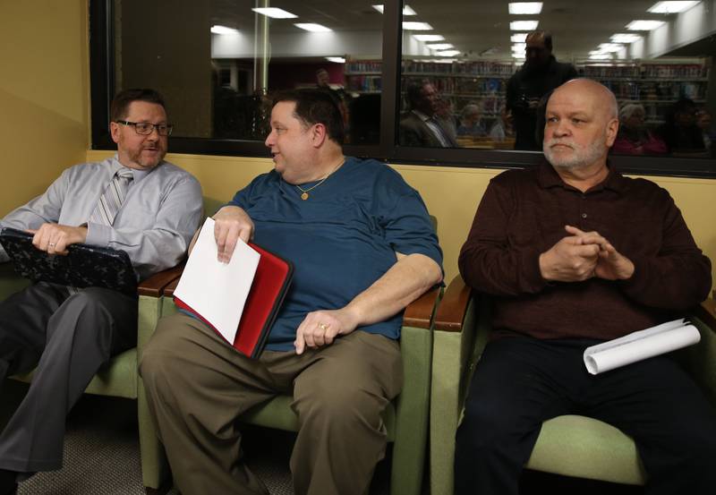 Oglesby mayoral candidates (from left) Jason Curran, Don Finley, and James Cullinan prepare to  deliver a speech during a mayoral and commissioner candidate forum on Wednesday, March 8,  2023 at the Oglesby Public Library.