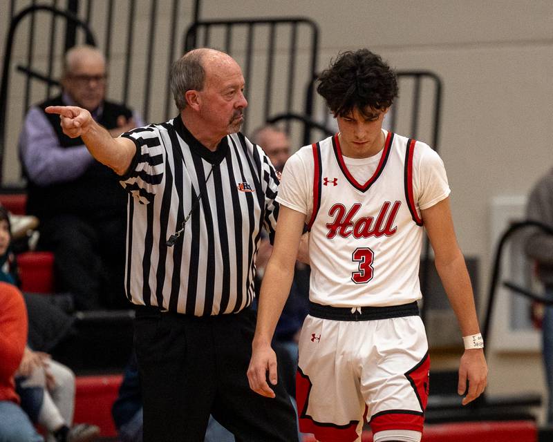 Official points switching possession back to Mendota as Noah Plym (3) of Hall exclaims frustration walking past official with head down on Saturday, December 20, 2025 at Hall High School in Spring Valley.
