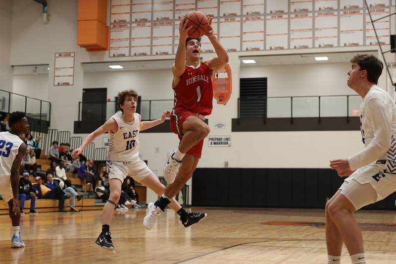 Hinsdale Central’s Evan Phillips drives in for the layup against Lincoln-Way East in the Lincoln-Way West Warrior Showdown on Saturday January 28th, 2023.