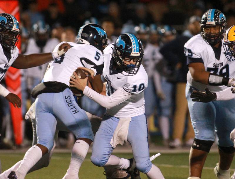 Downers Grove South quarterback Dominic West scrambles with the ball during the Class 8A second-round game on Friday, Nov. 8, 2024 at Lyons Township in Western Springs.