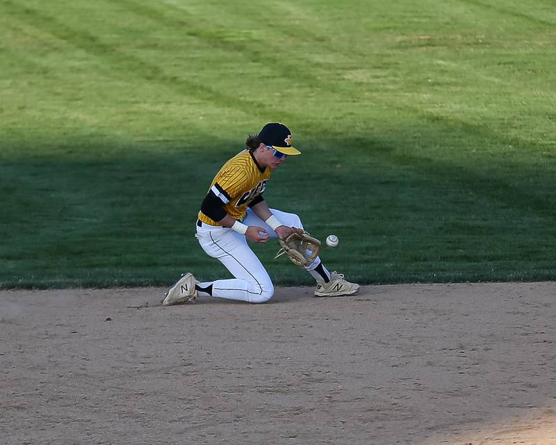 Joliet West's James Love (27) fields a grounder to record the last out of their varsity baseball game versus Oswego East.  April 10, 2023.