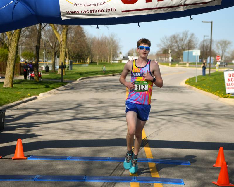 Adam Meitz of Downers Grove is the overall winner of the Mustang Trot on Sunday April 14, 2024, with a time of 18 minutes 50 seconds, held at Downers Grove South High School.