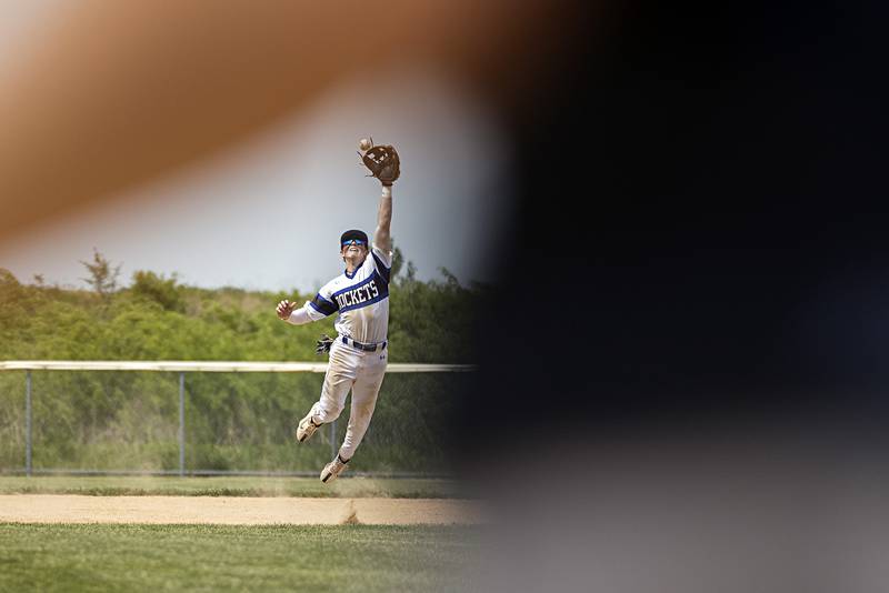 Burlington Central’s Brady Gilroy leaps to snag a high bouncer against Sterling during a class 3A regional final in Rochelle Saturday, May 27, 2023.
