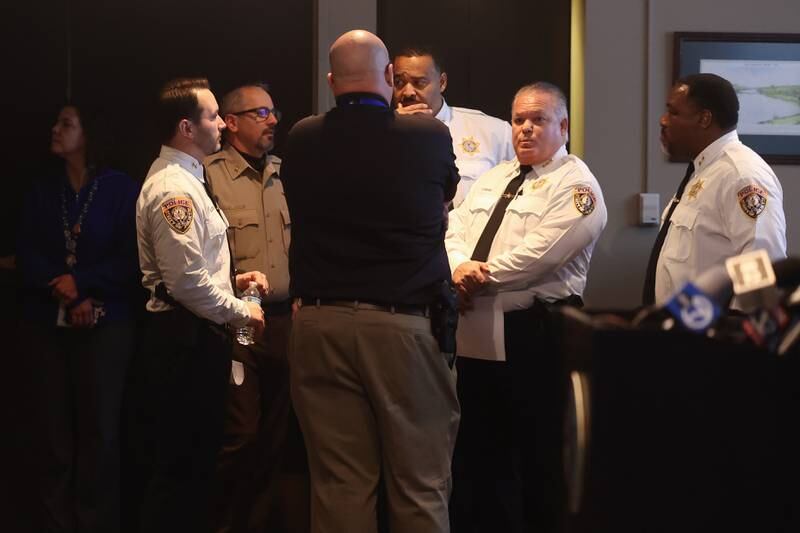 Members of the Joliet Police Department along with Will County Sheriff’s Deputy Chief Dan Jungles hold a briefing before the press conference to give updates on the mass shooting on the 2200 block of  West Acres Road on Sunday at Joliet City Hall on Tuesday, Jan. 23 in Joliet.  Seven people were killed in two homes. Another person was shot to death in Joliet Township that same day.