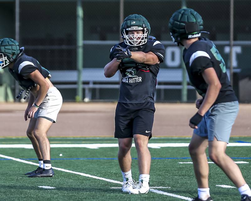 Maximus Hetlet points out the offense at Glenbard West football practice, Wednesday, Aug 21, 2025  in Glen Ellyn.
