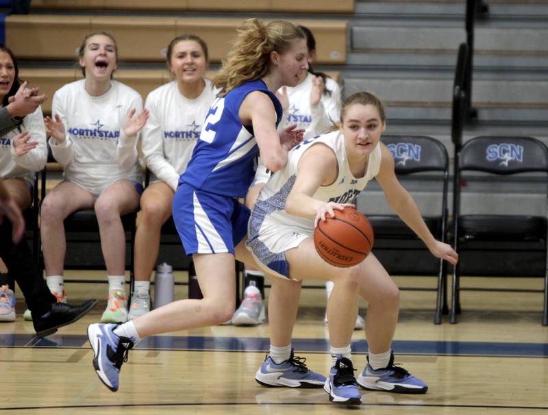 St. Charles North’s Elle Fuhr (right) reaches for the ball during the Class 4A St. Charles North Regional final against Wheaton North on Thursday, Feb. 16, 2023.