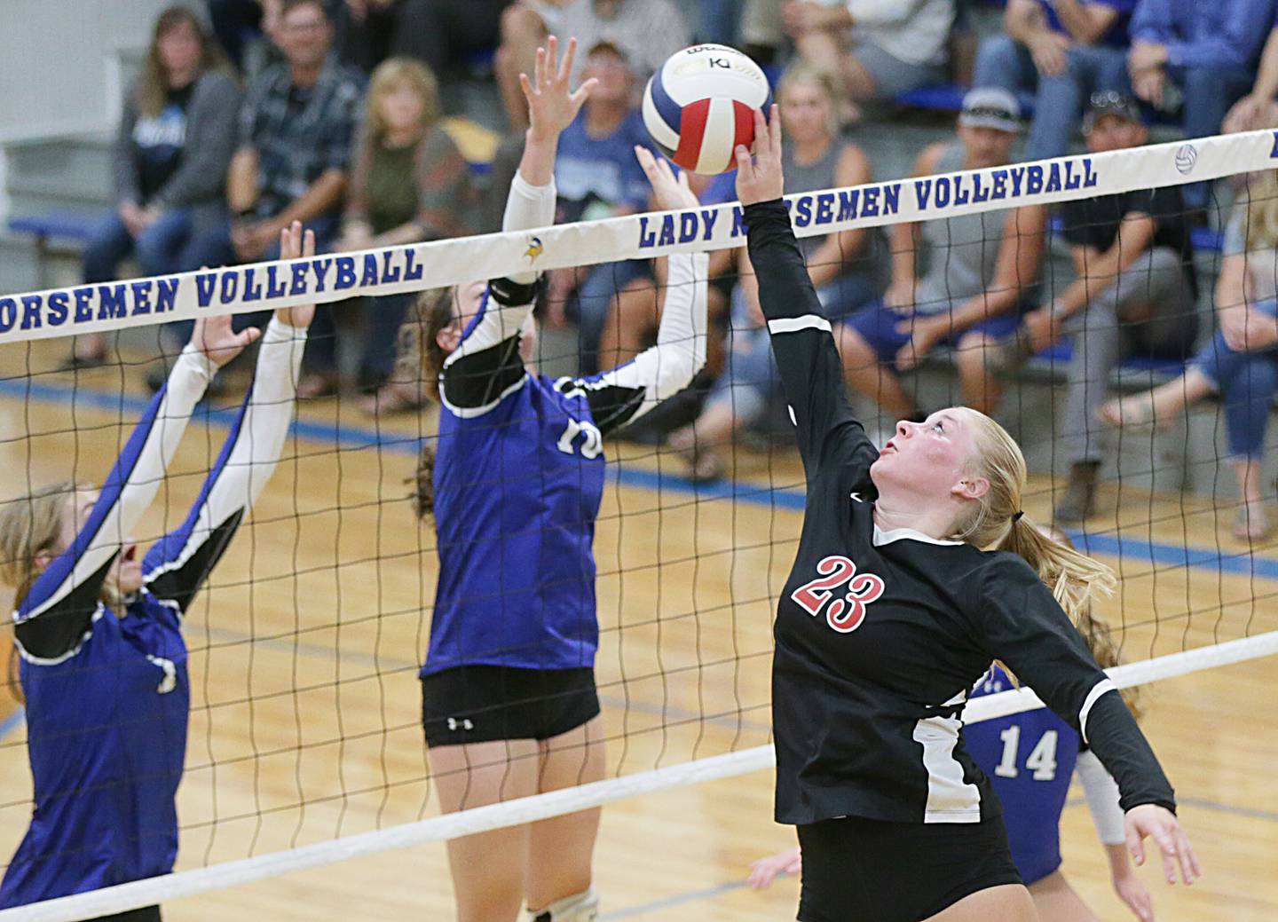 Earlville's Brooklyn Guelde (23) tips the ball past Newark defenders on Tuesday, Sept. 13, 2022, in Newark.