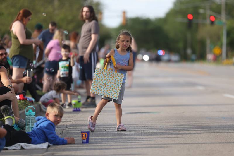 Alice Fry, 5, looks to see where the parade is at Old Canal Days Parade on Friday June 7, 2024 in Lockport.