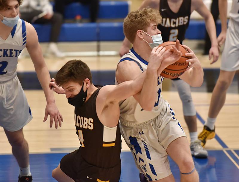 Burlington Central's Carson Seyller and Jacobs' Zach Leahy get tangled in the Fox Valley Conference semifinal boys basketball game in Burlington Thursday night, March 11, 2021.
