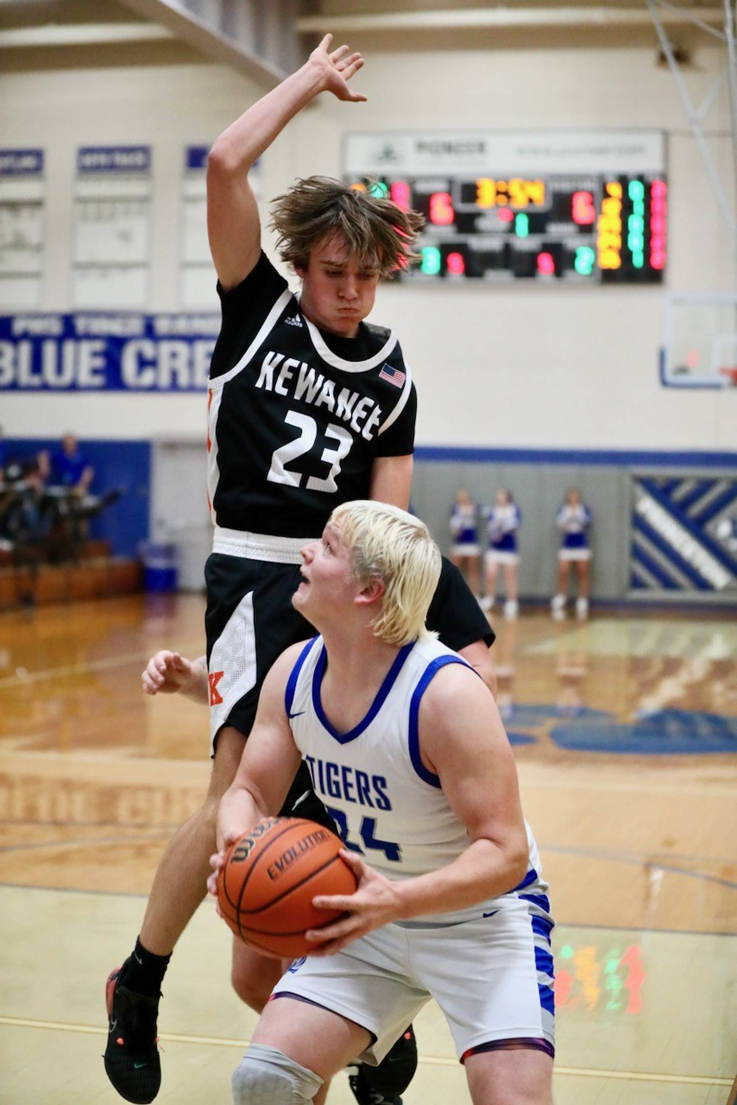 Princeton's Daniel Sousa gets Kewanee's Colson Welgat airborne before shooting Tuesday night at Prouty Gym. The Tigers won 61-55.