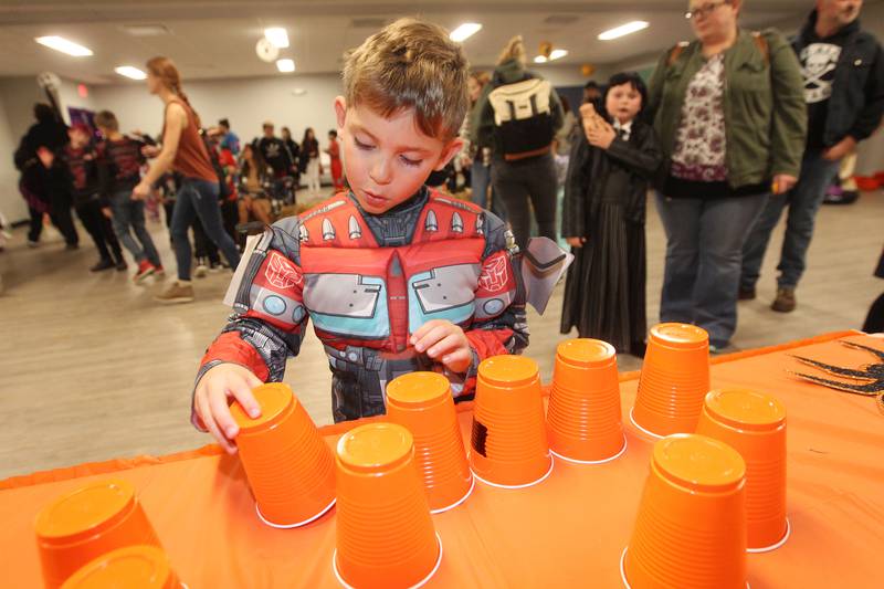 Brady Kukawski, 7, of Antioch wears his Transformers costume while making a jack-o-lantern out of plastic cups during Witchy Thrills & Chills at the Lindenhurst Park District Lippert Community Center on October 14th in Lindenhurst.
Photo by Candace H. Johnson for Shaw Local News Network
