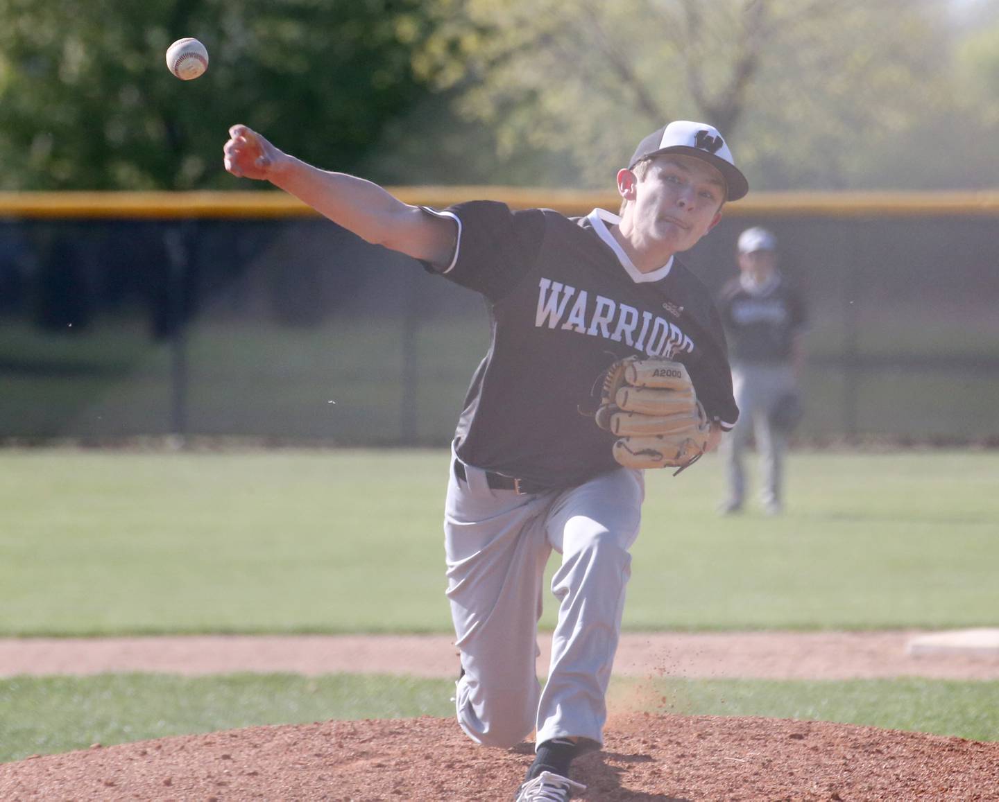 Woodland/Flanagan-Cornell's Tucker Hill delivers a pitch to a Putnam County batter in a game last season at Putnam County High School in Granville.