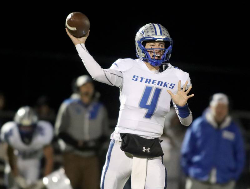 Woodstock’s quarterback Caden Thompson looks for an option  in varsity football at Woodstock North High School on Friday, October 24, 2025.