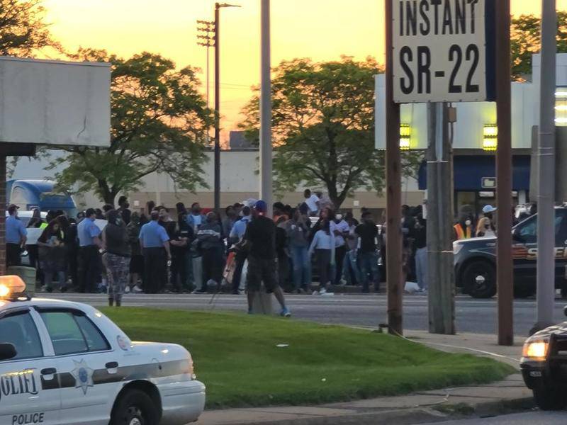 Police on Sunday try to control a demonstration at Jefferson Street and Larkin Avenue that eventually would began to spill into the street.