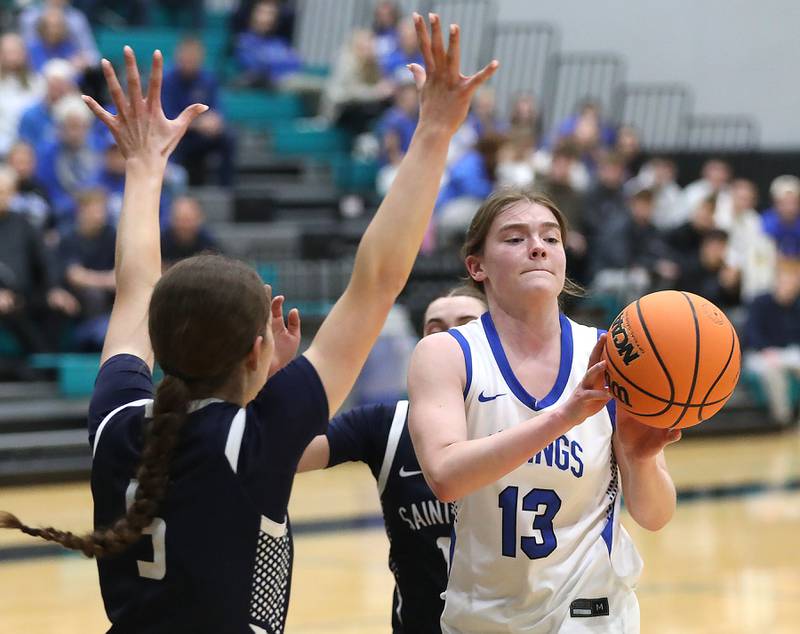 Geneva's Linnea Popp (right) passes the ball as she is guarded by St. Viator's Evelyn Hill during the IHSA Class 3A Woodstock North Supersectional girls basketball game on Monday, March 2, 2026, at Woodstock North High School.