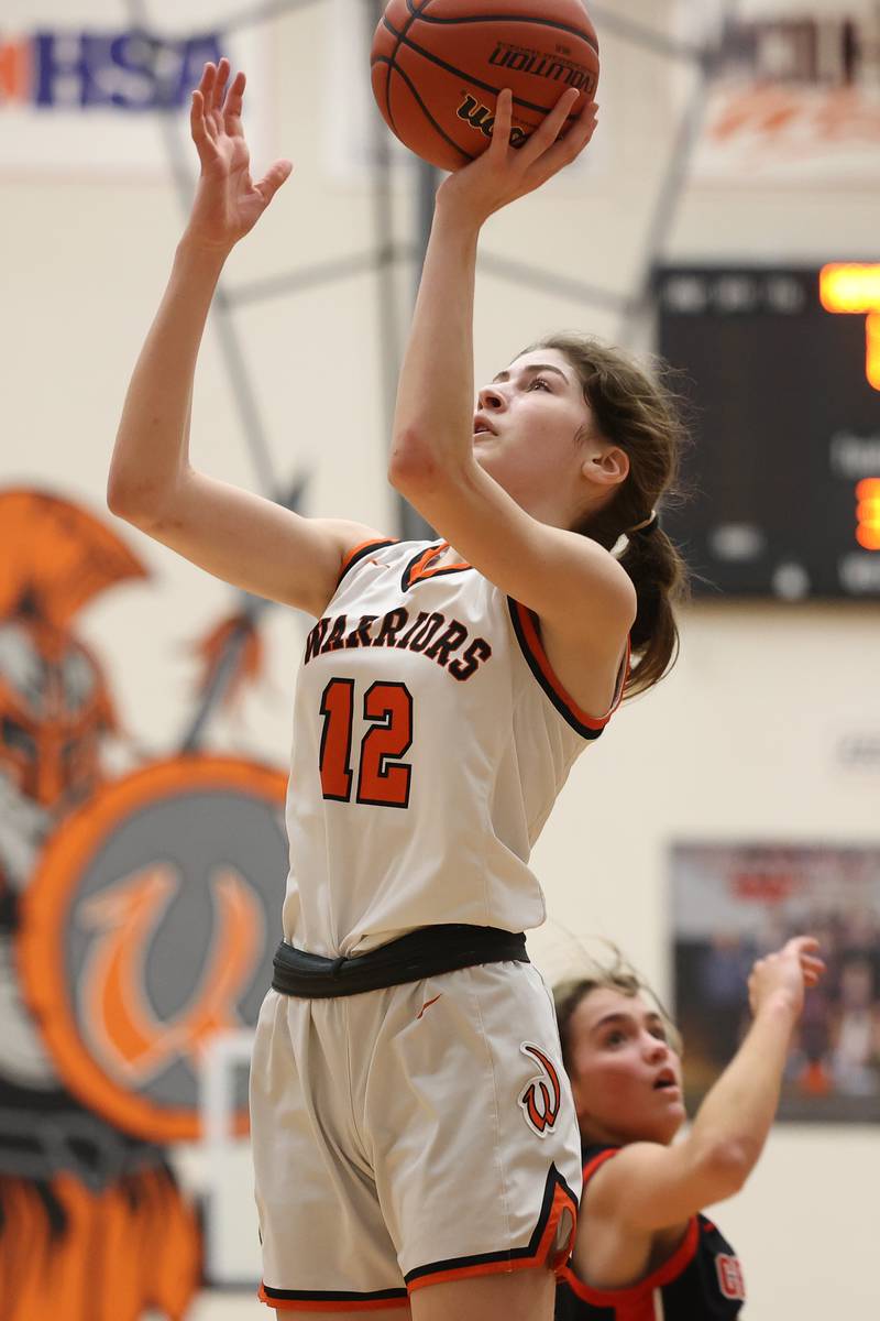 Lincoln-Way West’s Caroline Smith puts up a shot against Lincoln-Way Central on Tuesday, February 7th..