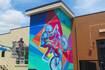Artist puts finishing touches on new downtown Oswego mural