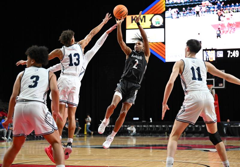 Kaneland's Isaiah Gipson shoots against DePaul College Prep defenders including Makai Kvamme (13) during the Class 3A boys supersectional at NOW Arena on Monday, March 10, 2025 in Hoffman Estates.