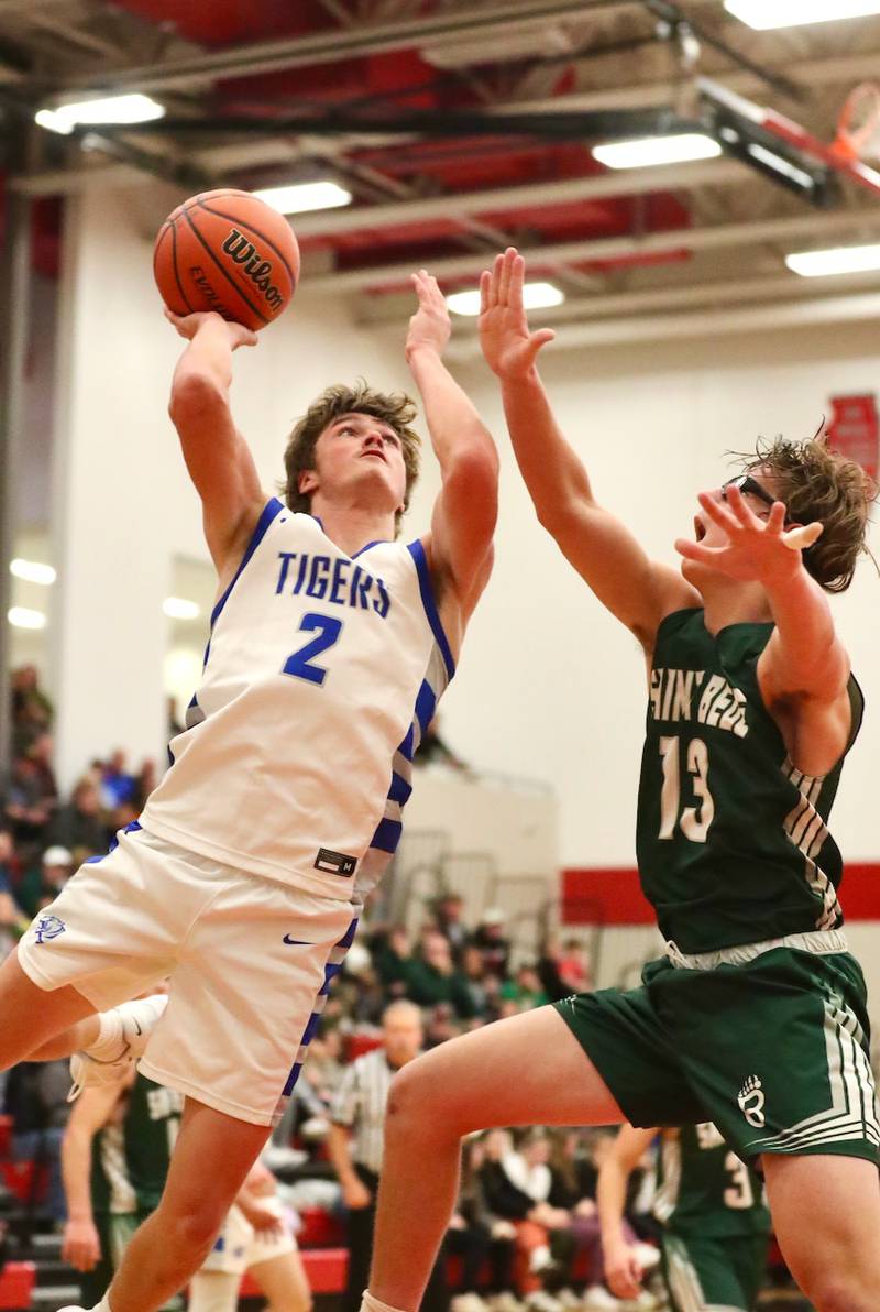 Princeton's Teegan Davis shoots over St. Bede's Landon Jackson Saturday night.