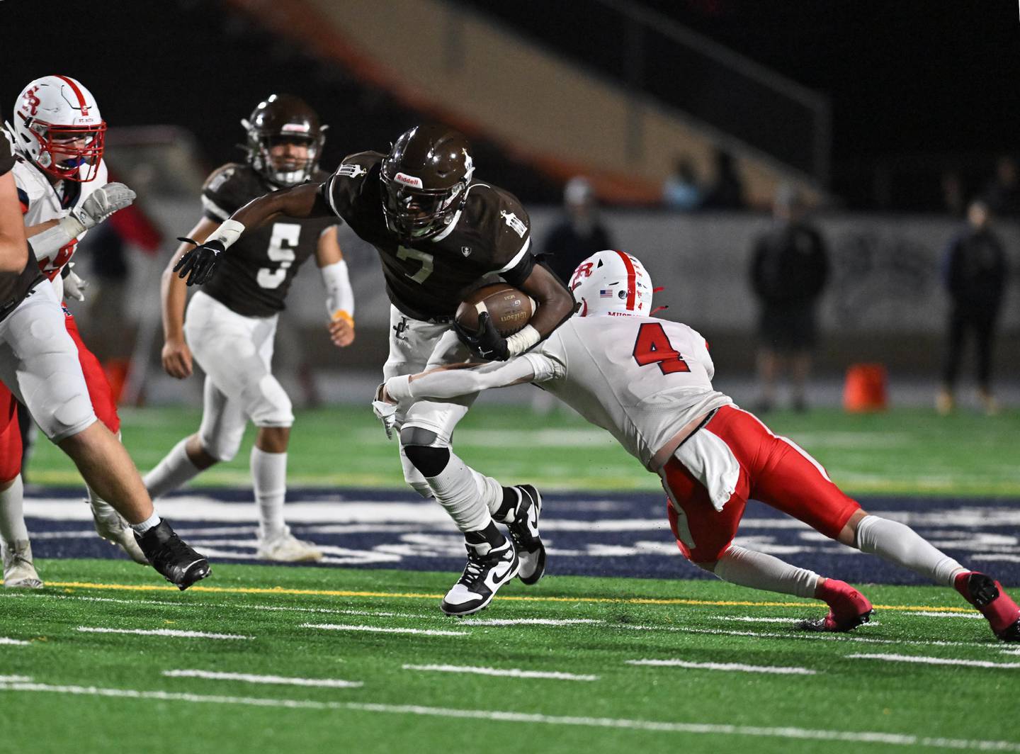 Joliet Catholic's Hiram J. Grigsby III tries to avoid a St. Rita defender during a nonconference game Friday, Sep. 8, 2023, at Joliet.