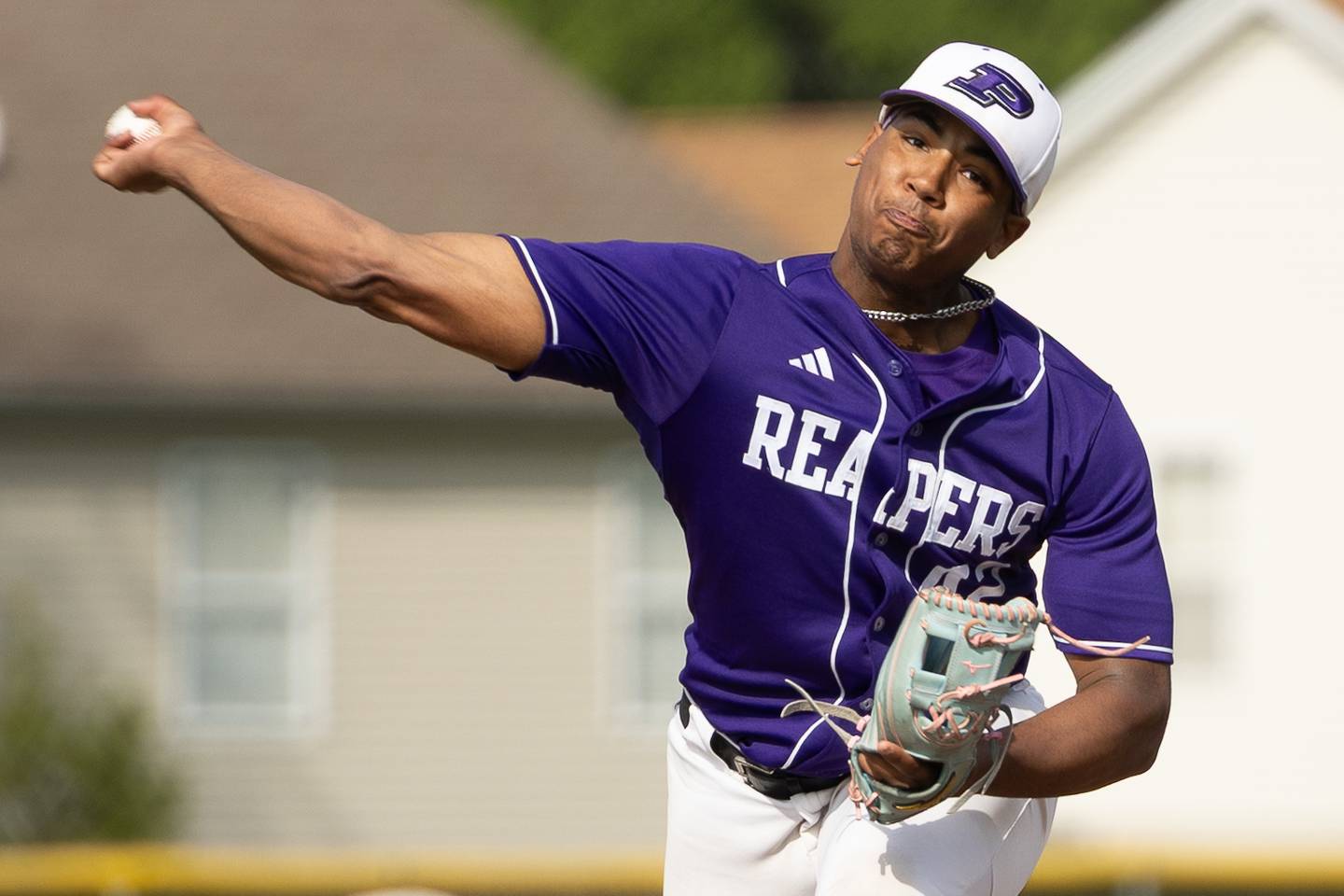 Plano's Jason Phillips delivers a pitch during Wednesday's game with Richmond-Burton at Plano.
