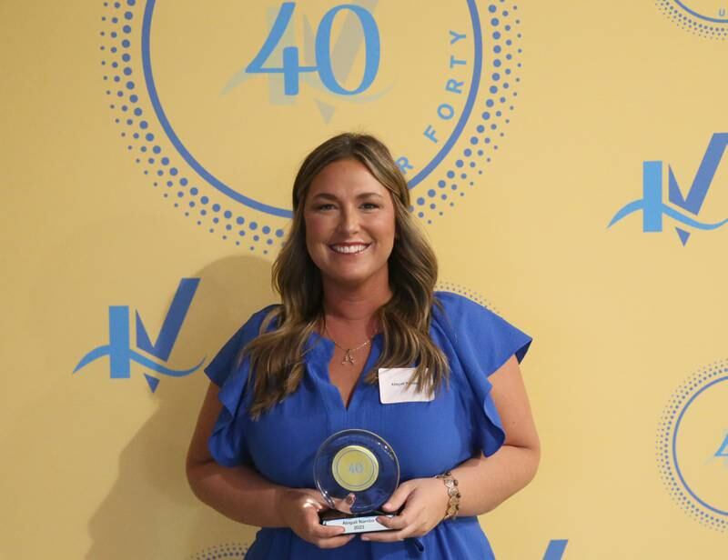 Abigail Nambo poses for a photo with her award during the 40 Under Forty awards banquet on Thursday, March 21, 2024 at Westclox in Peru.