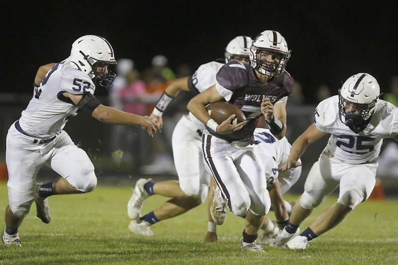 Prairie Ridge's Tyler Vasey runs away from the Cary-Grove defense during a Fox Valley Conference football game between Prairie Ridge  and Cary-Grove Friday, Sept. 23, 2022, at Prairie Ridge High School in Crystal Lake.