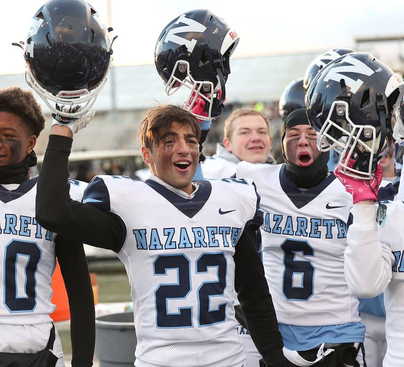 Nazareth players celebrate after their win over Sycamore Saturday, Nov. 18, 2022, in the state semifinal game at Sycamore High School.