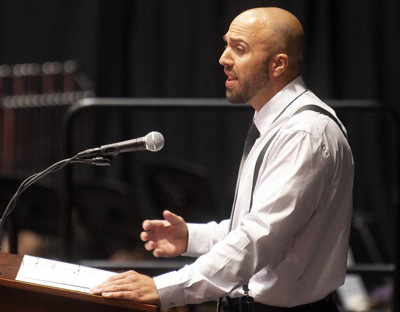 Chosen by the students, teacher Ryan Chatman addresses the graduates during Yorkville High School's class of 2022 graduation ceremony at the NIU Convocation Center on Friday, May 20, 2022.
