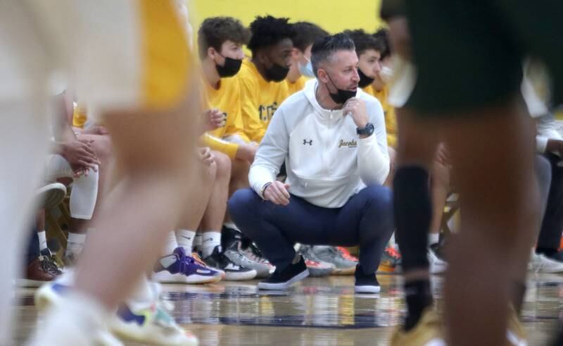Jacobs’ head coach Jimmy Roberts watches his Golden Eagles in boys varsity basketball action against Rockford Boylan at Algonquin Saturday afternoon.