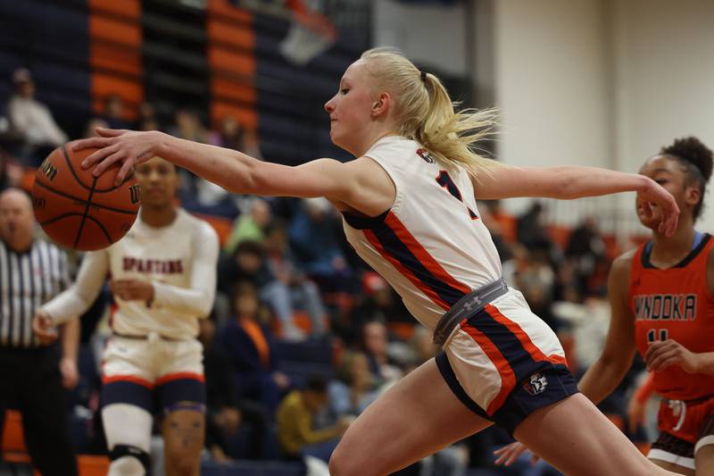 Romeoville’s Emily Gabrelcik lunges for the loose ball against Minooka on Tuesday January 24th, 2023.