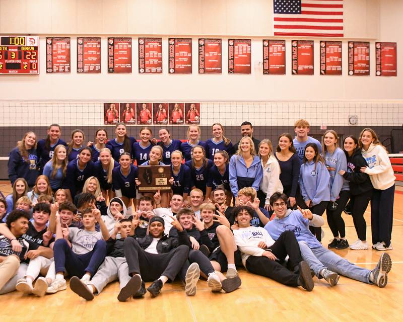Nazareth Academy’s volleyball team pose for a photo with the student section after winning the sectional title game against Geneva on Thursday Nov. 6, 2025, held at Timothy Christian High School.