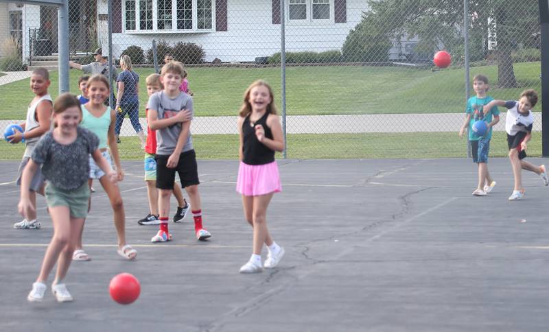 Kids play dodge ball during the National Night Out event on Tuesday, Aug. 5, 2025 at Kirby Park in Spring Valley.  The event featured prizes, dodge ball tournament, bounce house, face painting and more. National Night Out is an annual community policing campaign held on the first Tuesday of August to create police-community partnerships and build safer neighborhoods.