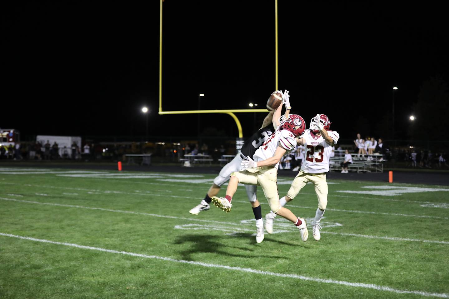 Morris' A.J. Zweeres makes a one-handed interception Friday in a 49-35 win over Kaneland.
