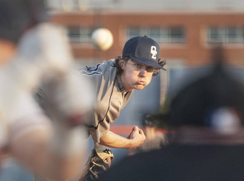 Oswego East pitcher Ashton Izzi fires a throw during a varsity boys baseball game on Thursday, May12, 2022 at Oswego High School.