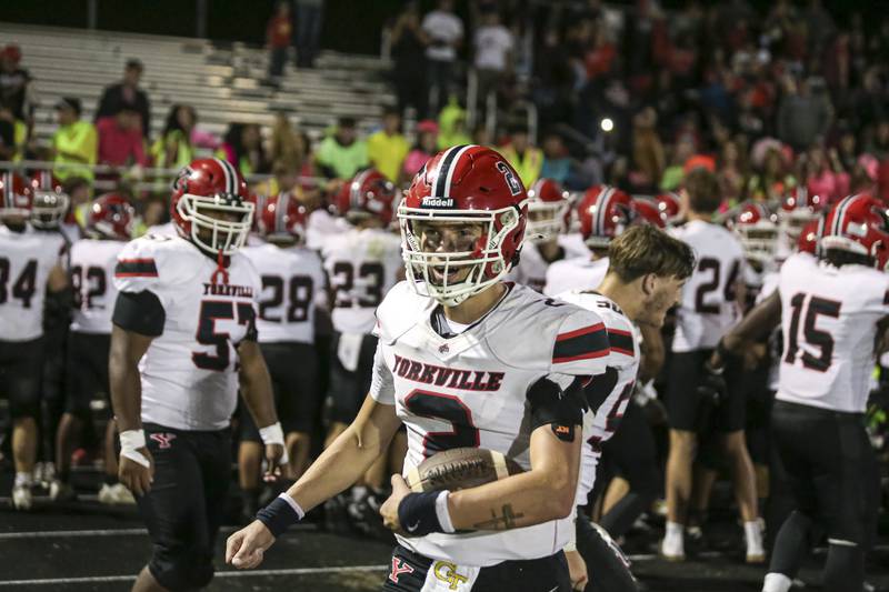 Yorkville's Jack Beetham (2) celebrates with teammates after winning their during football game at Oswego Friday, Sept 26, 2025 in Oswego.