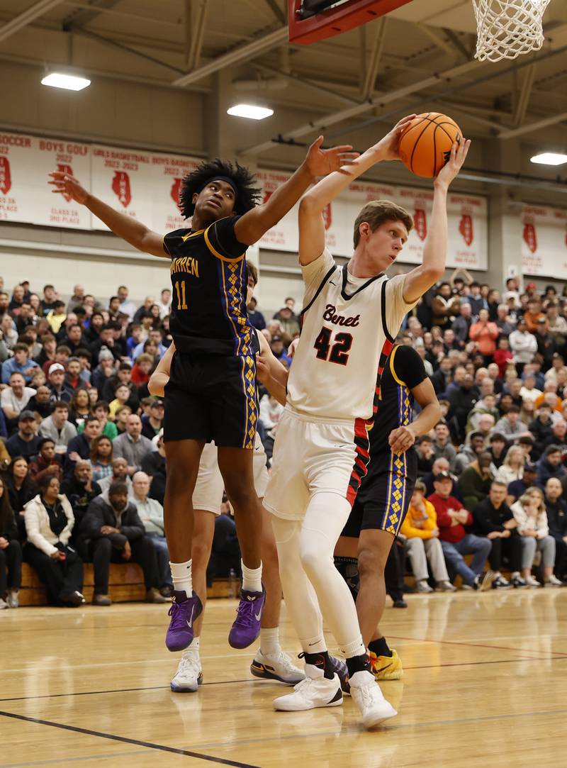 Benet's Colin Stack (42) grabs a rebound during the When Sides Collide Shootout basketball tournament between Benet Academy and Warren Township high schools on Saturday, Jan. 24, 2026 in Lisle, IL.