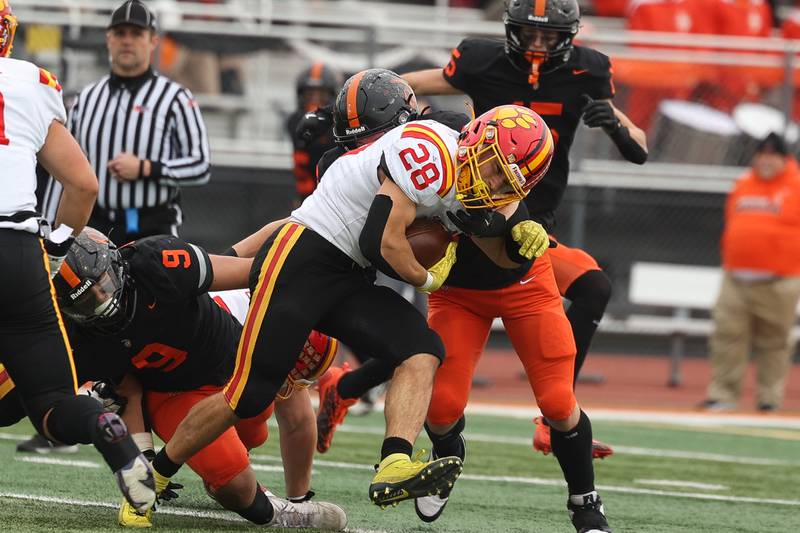 Batavia’s Nathan Whitewall powers for a first down against Lincoln-Way West on Saturday, Nov. 9, 2024 in New Lenox.