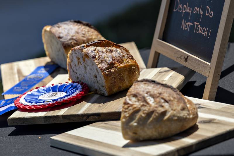 Sourdough loafs at the Made That Myself booth are put on display Saturday, August 23, 2025, at the Art in the Park sculpture walk in Rock Falls.