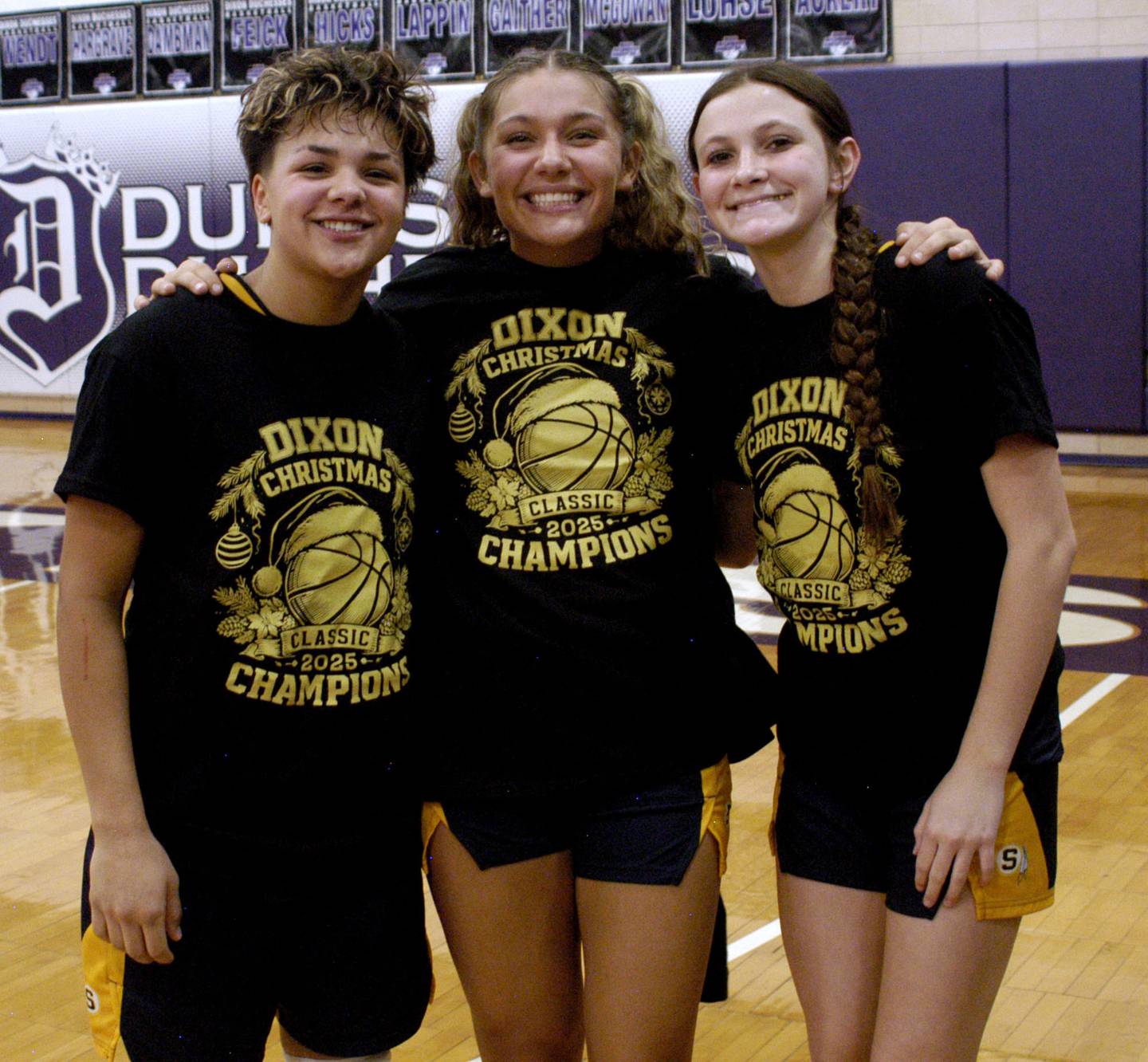 Joslyn James, sister Jaelynn and Brenley Johnson pose with their tourney shirts .The Sterling Golden Warriors played  the Byron Tigers in the championship game of the Dixon Holiday Tournament at Dixon High School on Monday, December 29th, 2025.