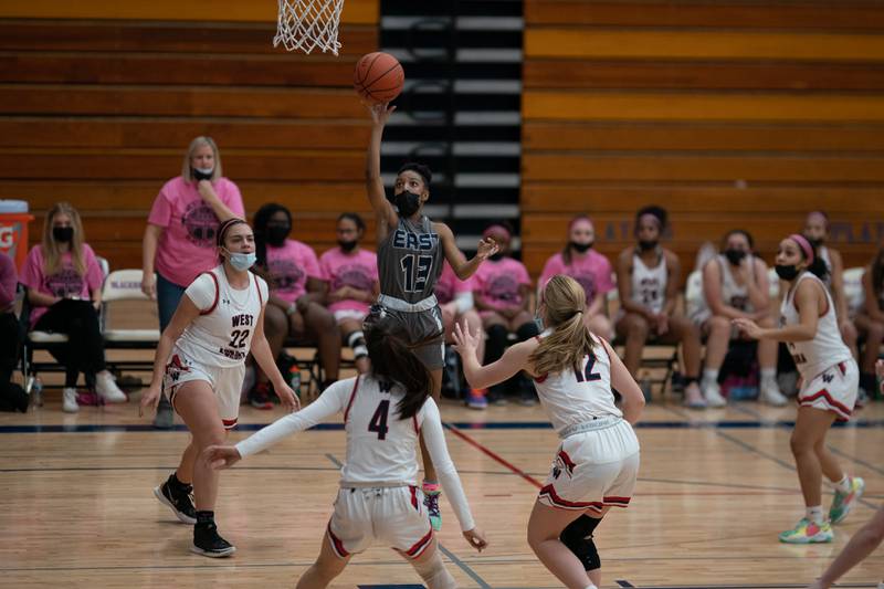 Oswego East's Cydnei Mitchell (13) shoots a floater against West Aurora during a basketball game at West Aurora High School on Wednesday, Jan 26, 2022.