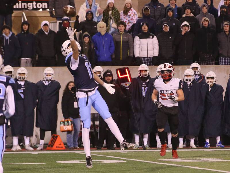 DePaul's Jack West misses a catch as Mt. Zion's Kaden Becker trails behind during the Class 4A State football championship on Friday, Nov. 29, 2024 at Hancock Stadium in Normal.